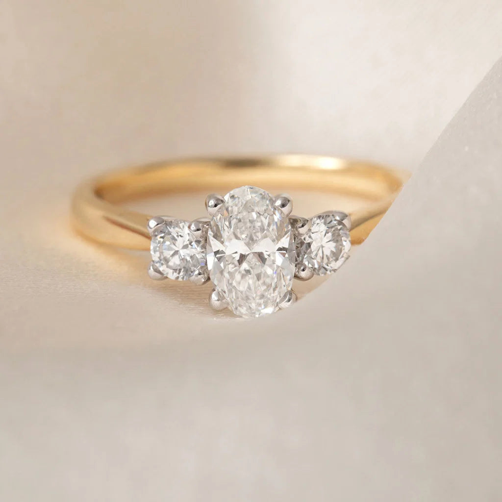 Oval 3-Stone Natural Diamond Engagement Ring in 18 karat Gold